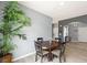 Dining area showcasing a round table and chairs adjacent to a living space with natural light at 6429 Pronghorn Ridge Ave, Las Vegas, NV 89122