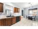 Stylish kitchen featuring wooden cabinetry and a cozy breakfast nook at 6429 Pronghorn Ridge Ave, Las Vegas, NV 89122