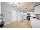 Well-lit kitchen with white cabinets, stainless steel appliances, and a decorative 'It's Wine Time!' accent at 6429 Pronghorn Ridge Ave, Las Vegas, NV 89122