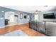 Open-concept living room seamlessly connecting to the dining area, with hardwood floors and a modern aesthetic at 6429 Pronghorn Ridge Ave, Las Vegas, NV 89122