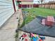 View of the side of the home with a small portion of the backyard at 6489 Gunderson Blvd, Las Vegas, NV 89103