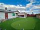 A view of the backyard featuring grass and play structure at 6489 Gunderson Blvd, Las Vegas, NV 89103