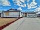 Single story home featuring a long driveway and lawn at 6489 Gunderson Blvd, Las Vegas, NV 89103