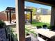 A delightful backyard is perfect for entertaining with pergola, patio, and drought-tolerant landscaping at 6507 Dove Point Pl, Las Vegas, NV 89130