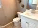 Cozy powder room with modern fixtures, decorative wall art and elegant tiling at 6507 Dove Point Pl, Las Vegas, NV 89130