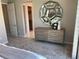 Well-lit bedroom with a modern dresser and an entrance to a closet at 6507 Dove Point Pl, Las Vegas, NV 89130