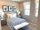 Comfortable bedroom with stylish decor and lots of natural light at 6507 Dove Point Pl, Las Vegas, NV 89130