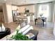Open floorplan showcasing the kitchen, dining, and living area with tile floors at 6507 Dove Point Pl, Las Vegas, NV 89130