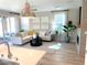 Well-lit living room features tile floors, modern décor, and a fireplace with mounted TV at 6507 Dove Point Pl, Las Vegas, NV 89130