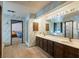 Large bathroom features double sinks, extensive counter space, and designer wallpaper at 6998 Alamitos Cir, Las Vegas, NV 89120