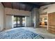 Spacious bedroom boasts a stone fireplace, wood beam ceiling, and doors to backyard at 6998 Alamitos Cir, Las Vegas, NV 89120