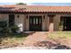 Charming front door with brick walkway and manicured landscaping at 6998 Alamitos Cir, Las Vegas, NV 89120