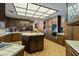 Spacious kitchen with wooden cabinets and central island with integrated sink at 6998 Alamitos Cir, Las Vegas, NV 89120