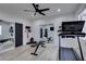 Bright exercise room with mirrored walls, workout equipment, and wood-look flooring at 7310 Southern Magnolia St, Las Vegas, NV 89149