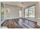 Elegant dining area featuring hardwood floors, natural light, and access to outdoor spaces at 8200 Horseshoe Bend Ln, Las Vegas, NV 89113