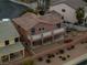 This house has a large back deck, manicured landscaping and a desert stone yard at 827 Happy Sparrow Ave, Henderson, NV 89052