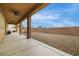 This spacious backyard features a covered patio and desert landscaping at 827 Happy Sparrow Ave, Henderson, NV 89052