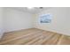Bedroom with wood-look flooring and a window overlooking the neighborhood at 827 Happy Sparrow Ave, Henderson, NV 89052