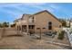 Two-story home featuring a spacious backyard and outdoor dining area at 827 Happy Sparrow Ave, Henderson, NV 89052