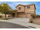 Charming two-story home featuring a stucco facade, three-car garage, landscaped front yard, and covered porch at 827 Happy Sparrow Ave, Henderson, NV 89052
