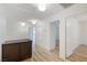 Hallway features wood floors, storage cabinet, and doorway to the bedroom at 827 Happy Sparrow Ave, Henderson, NV 89052