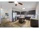 Spacious kitchen with island, stainless steel appliances, and stylish tile flooring at 827 Happy Sparrow Ave, Henderson, NV 89052