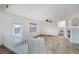 Upstairs living area with cozy fireplace, sleek ceiling fan, and bright natural light at 827 Happy Sparrow Ave, Henderson, NV 89052
