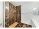 Luxurious bathroom shower features elegant tiling, rain shower head, and modern fixtures at 827 Happy Sparrow Ave, Henderson, NV 89052