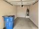 Spacious garage equipped with water heater and trash bin, ready for your vehicles or storage needs at 8428 Viansa Loma Ave, Las Vegas, NV 89149