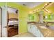Bathroom with double sinks, granite countertops, and an entrance to the bedroom at 8988 Dusseldorf Way, Las Vegas, NV 89147