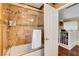 Bathroom featuring a glass-enclosed tub and shower with stylish tile details at 8988 Dusseldorf Way, Las Vegas, NV 89147