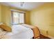 Bright bedroom featuring a window, soft natural light, and cozy furnishings at 8988 Dusseldorf Way, Las Vegas, NV 89147