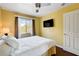 Bedroom with a ceiling fan, lamp, and a view of the outside at 8988 Dusseldorf Way, Las Vegas, NV 89147