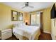 Bedroom with natural light, hard floors, and a wall-mounted television at 8988 Dusseldorf Way, Las Vegas, NV 89147