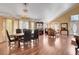 Spacious dining room features hardwood floors and elegant chandelier lighting at 8988 Dusseldorf Way, Las Vegas, NV 89147