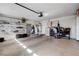 A spacious garage with storage cabinets and room for parking at 8988 Dusseldorf Way, Las Vegas, NV 89147