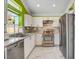 White kitchen with granite countertops and stainless steel appliances at 8988 Dusseldorf Way, Las Vegas, NV 89147