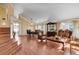 Spacious living room with hardwood floors, large windows, and ornate decor at 8988 Dusseldorf Way, Las Vegas, NV 89147