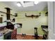 A room with wood shelves and a workout machine at 8988 Dusseldorf Way, Las Vegas, NV 89147