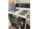 Basic white and black gas stove with an oven at 8988 Dusseldorf Way, Las Vegas, NV 89147