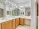 Bathroom with double vanity sinks, framed mirrors, and recessed lighting at 9160 Moose Country Pl, Las Vegas, NV 89178