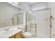 Bathroom featuring a shower with glass door, tile flooring, and a modern vanity at 9160 Moose Country Pl, Las Vegas, NV 89178