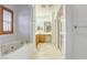 Bright bathroom featuring a soaking tub, glass shower, and natural light at 9160 Moose Country Pl, Las Vegas, NV 89178