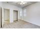 Cozy bedroom with carpet flooring, a mirrored closet, and a bright window at 9160 Moose Country Pl, Las Vegas, NV 89178