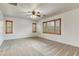 Spacious bedroom with carpet flooring, multiple windows, and ample natural light at 9160 Moose Country Pl, Las Vegas, NV 89178