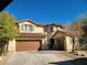 Charming two-story home featuring a three-car garage, stucco exterior, tile roof, and well-maintained landscaping at 9160 Moose Country Pl, Las Vegas, NV 89178