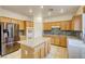 Bright kitchen with stainless steel appliances, granite countertops, and a functional center island at 9160 Moose Country Pl, Las Vegas, NV 89178