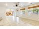 Open-concept living room with tile floors and plenty of natural light at 9160 Moose Country Pl, Las Vegas, NV 89178