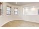 Bright loft area with neutral carpeting, recessed lighting, and three large windows with wood-like blinds at 9160 Moose Country Pl, Las Vegas, NV 89178