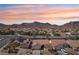 Panoramic aerial view showcases the desert neighborhood and mountains behind the home, highlighting the serene location at 1019 Amber Gate St, Henderson, NV 89002